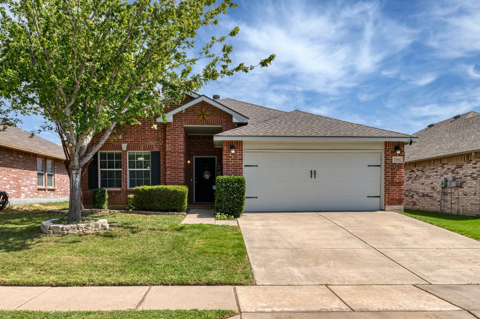 Front exterior of 7016 Derbyshire Dr, Fort Worth, TX 76137